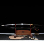 Black Mythical katana, sharp blade and black scabbard displayed separately on wooden stand, ideal for collection display.