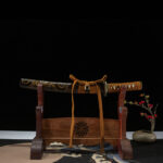Golden Dragon Blade, complete display with wooden stand, black scabbard with golden dragon pattern, brown handle, traditional collectible samurai sword