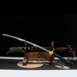 Green Shade Katana, complete display with wooden stand, black scabbard with golden patterns, green handle, collectible samurai sword