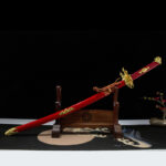 Crouching Dragon Sword, complete display with wooden stand, red scabbard and golden dragon motifs, traditional collectible samurai sword