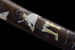 Premium Tanto scabbard close-up, showcasing exquisite golden dragon pattern.