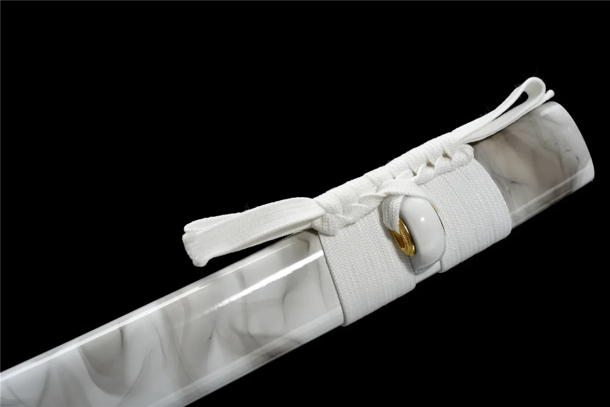 Plastic Training Knife Type A scabbard knot and tassel detail in white plastic with gold-tone ring, training samurai sword, plastic training sword