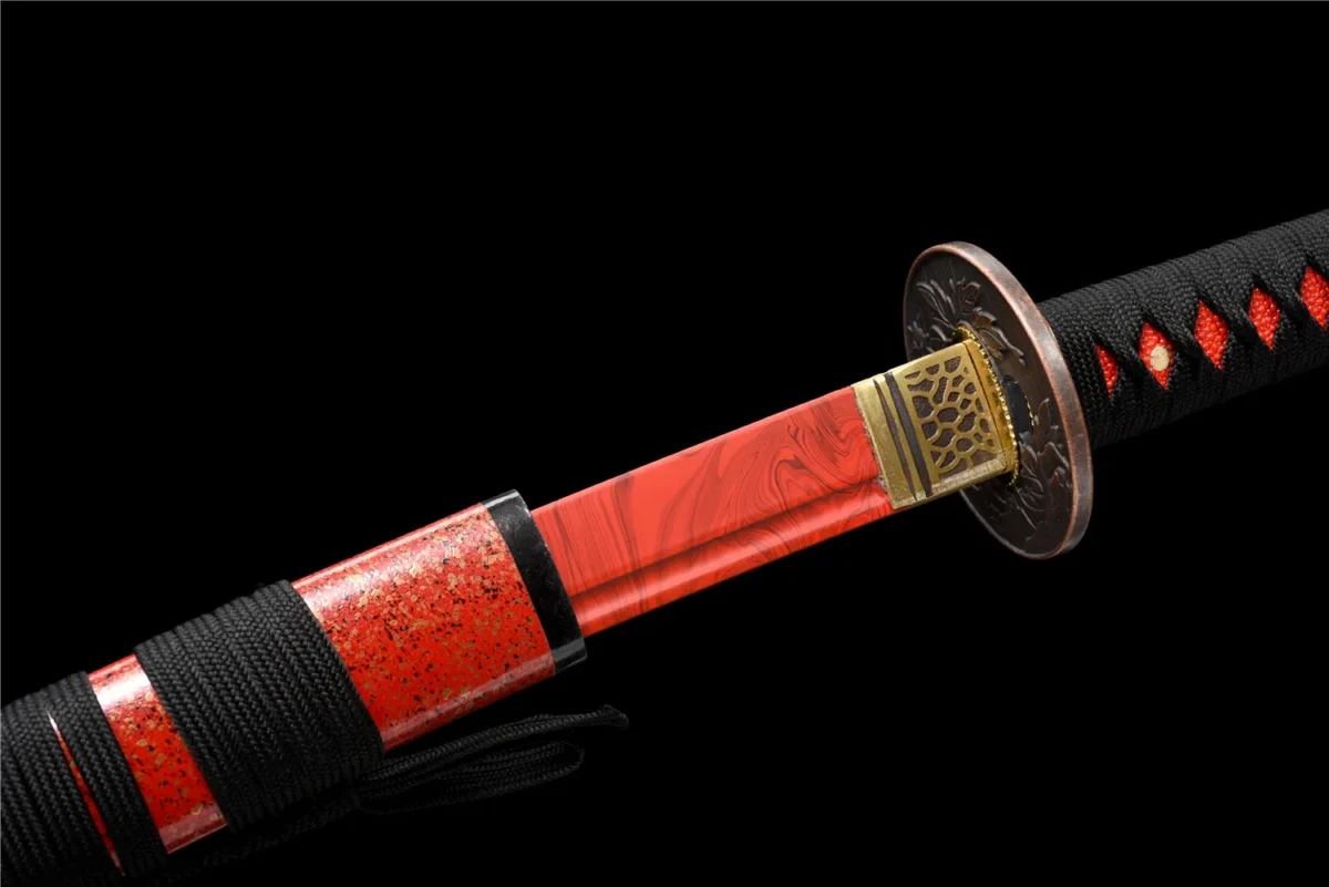 red Plastic Training Knife handle and fuchi guard junction detail in red molded plastic, training samurai sword, plastic training sword