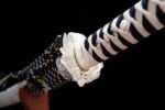 White Lotus Knife saya and hilt connection detail, showcasing the blue and white ito wrap with intricate white fittings, highlighting the katana's assembly craftsmanship.