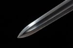 Wind Messenger blade tip, sharp point, polished steel, cutting precision.