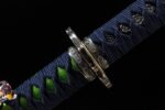 Shogun Tachi, close-up of the scabbard and hilt connection, showing the blue ito wrap, silver tsuba, and kurikata details, highlighting the katana's intricate assembly and transition.
