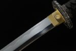 Buddha and Demon Sword handle wrap connected to golden habaki, unique handguard design, showing harmony between blade and handle