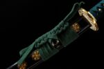 Green Shade Katana scabbard joint, seamless green and gold pattern transition, showcasing fine craftsmanship.