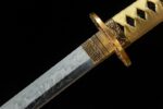 Double Dragon Sword, close-up of the katana blade, showing the clear Damascus steel pattern and intricate golden tsuba details, highlighting its unique blade shape.