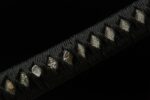 Toyama Dragon Sword handle black wrapping and white rayskin detail, showcasing fine grip craftsmanship and texture
