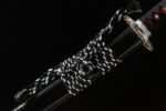 Salo knife, scabbard, black and white wrapped cord, golden ring, black sheath, modern design, knife accessory display