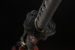 Blood Eagle Guard Japanese Sword, black openwork guard, floral design, gold details, handle connection, exquisite craftsmanship, weapon accessory