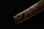 Golden Dragon Blade scabbard end close-up, showcasing intricate carving and patterns