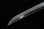 Buddha and Demon Sword blade tip, sharp and finely polished, showcasing traditional forging craftsmanship