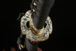 Red Flame Dragon Soul Katana Tsuba detail, gold finish, traditional Japanese design.
