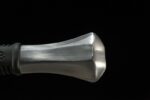 Knight Sword pommel detail, polished metal, balanced weight, traditional style.