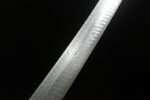 Dragon Slayer Sword blade close-up, clearly showing forging process texture