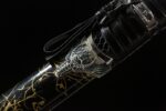 Mo Yulong Knife scabbard section, black base with irregular gold pattern, enhancing visual appeal.