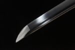 Salo knife sharp blade tip close-up, showcasing fine edge profile and excellent piercing ability