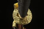 Emperor's Golden Blade tsuba and pommel close-up, golden embellishments, reflecting overall harmony