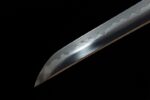 Green Shade Katana sharp blade tip close-up, showcasing its polished surface and clear cutting angle.