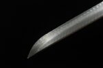 Dragon Slayer Sword blade tip close-up, with overall blade curvature