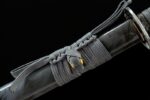 Tenmoku Japanese sword scabbard kurigata close-up, showcasing cord tying method and glossy scabbard surface