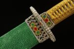 Daming Imperial Sword scabbard mouth close-up, showcasing green ray skin texture, ornate guard, and jewel inlays