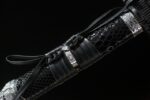 Space warrior knife, scabbard, black snake pattern, leather straps, silver engraved buckles, futuristic design, weapon detail display