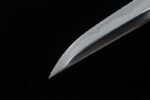 Night Blade sword, close-up of sharp silver tip, showcasing cutting edge and expert grinding craftsmanship.