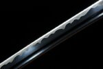 Tenmoku Japanese sword blade section, showcasing detailed forging texture and light reflection