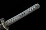 Tenmoku Japanese sword handle overall close-up, showcasing grey wrapping and black menuki details