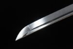 Space Warrior sharp blade tip close-up, showing cutting edge and high-gloss surface.