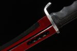 Spartan Warrior Knife handle connection, secure grip, red blade transition.