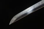 Yulong Japanese Sword blade close-up, showcasing its high polish and sharp edge line, highlighting cutting performance.