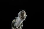 Tenmoku Japanese sword pommel close-up, showcasing exquisite metal carving and wrapping end