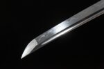 Demon-killing Sword sharp blade tip close-up, showing clear hamon temper line, highlighting cutting performance.