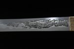 Night Blade sword, close-up of complex figure engraving on metal blade, showcasing artistic texture and forging craftsmanship.