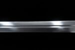 Brown European Sword blade mid-section close-up, revealing metallic sheen and cutting edge line