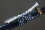 Dawnbringer scabbard kurigata close-up, showing blue body and wrapped knot details
