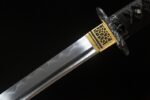 Demon-killing Sword blade and Tsuba junction, showcasing fine metalwork.