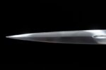 Brown European Sword blade tip close-up, showcasing sharp shape and metallic sheen
