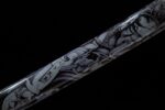 Tenmoku Japanese sword scabbard mid-section close-up, showcasing unique dark background with light irregular pattern