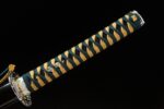 Warrior Soul handle close-up, showcasing unique color wrapping and golden fittings
