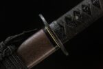Demon-killing Sword handle section, showing brown wrapping material and texture.