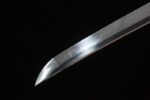 Snow Lotus Warrior sharp blade tip close-up, showcasing its high polish and clear cutting angle.