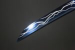 Dawnbringer sword blade close-up, showcasing unique blue light effect and texture