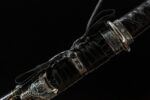 Mo Yulong Knife, close-up of the black leather scabbard with an intricately tied black sageo knot, showcasing the scabbard's leather texture and the knot's craftsmanship.