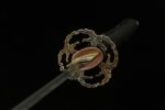 Toyama Dragon Sword blade and handle connection, golden habaki and black handle wrap, showing structural details