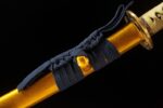 Double Dragon Sword scabbard mid-section, gold dragon pattern on black lacquer and blue decorative cord, rich in detail.